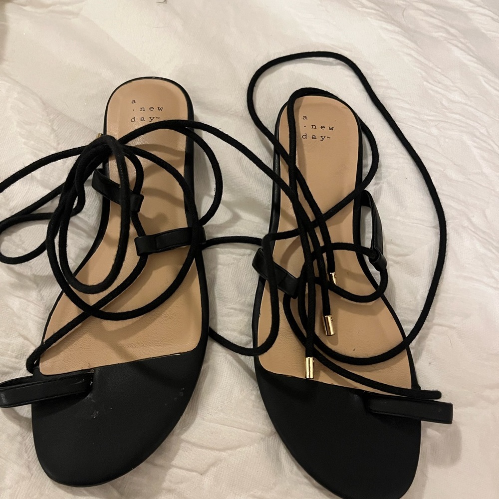 Women’s strappy, tie up sandals.